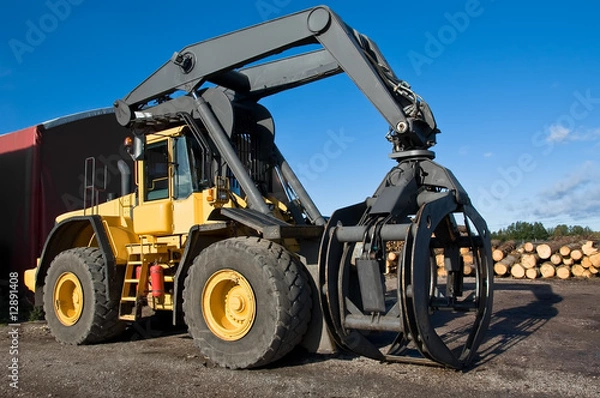Fototapeta Big yellow grapple loader
