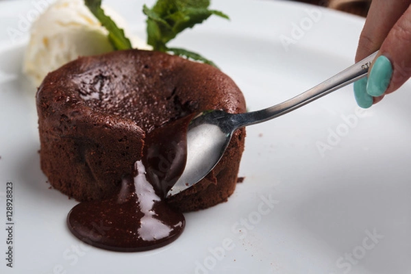 Obraz Concept: restaurant menus, healthy eating, homemade, gourmands, gluttony. White plate with chocolate fondant and ice cream on a messy vintage wooden background.