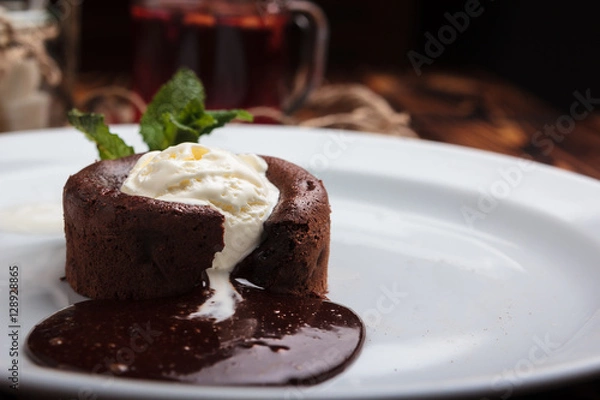 Obraz Concept: restaurant menus, healthy eating, homemade, gourmands, gluttony. White plate with chocolate fondant and ice cream on a messy vintage wooden background.