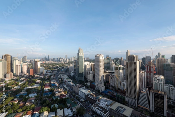 Fototapeta Makati Skyline at night. Makati is a city in the Philippines` Metro Manila region and the country`s financial hub. It`s known for the skyscrapers and shopping malls.