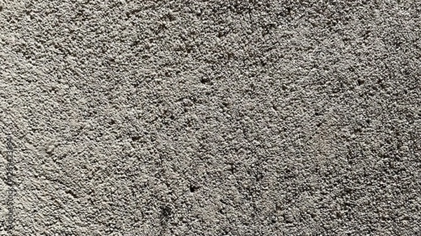 Obraz rough and mottled surface texture. The surface appears light gray with slightly darker color variations in some areas, giving the impression of three dimensions and shadows