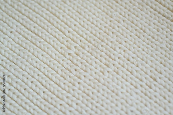 Fototapeta white texture of knitted wool fabric as a background, white smooth symmetrical lines of hand-knitted needlework pattern	
