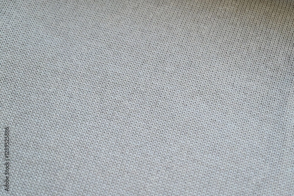 Fototapeta Macro texture of light gray wool crochet sweater as background, close-up of purple crochet front surface, texture of woolen wool, crochet front surface	
