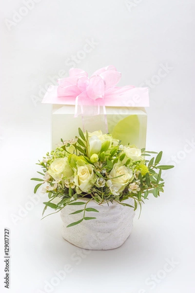 Obraz Gift and flowers on a white background