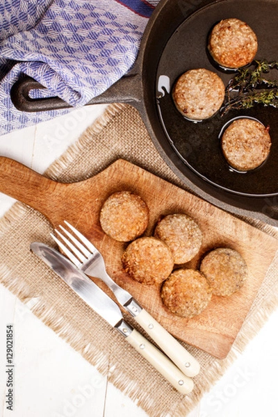 Obraz grilled irish white pudding in a pan and on wooden board