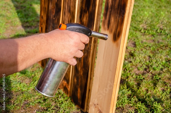 Obraz Wood processing with a gas burner.