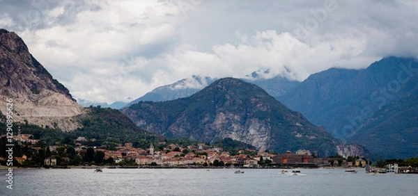 Fototapeta Beautiful views of Baveno on Lake Maggiore framed by mountains under an overcast sky