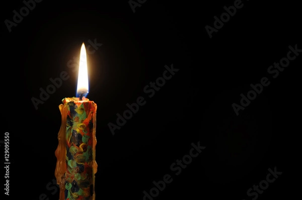 Obraz Candle on a black background