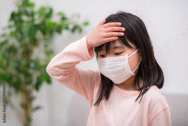 Obraz 医療用マスクを着用する小学生の女の子