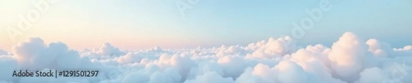 Fototapeta Soft white cloud cushion atop sky of light blue and pale pink softness, peaceful, cloudy, tranquil