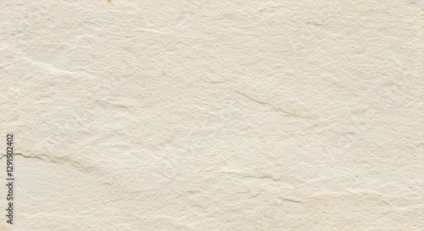 Fototapeta A warm white rough stone texture with a grainy surface.