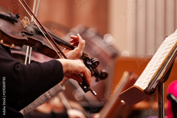 Obraz  Close-up of a woman's hands playing the violin