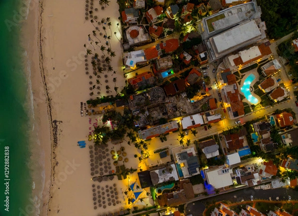 Obraz A beach with a city in the background