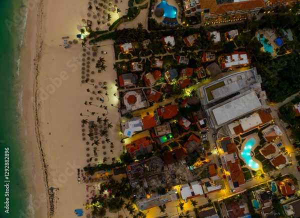 Obraz A beach with a town in the background