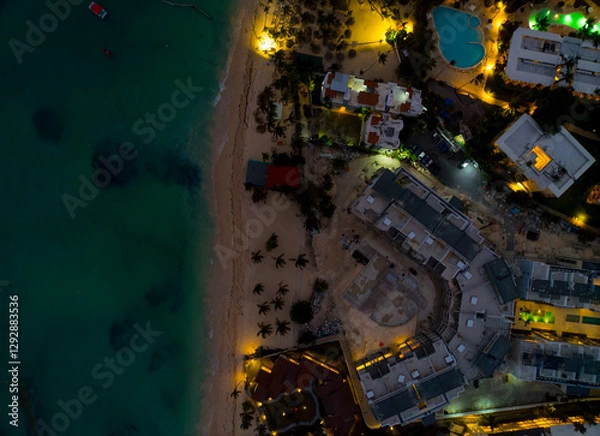 Obraz A beach with a city in the background