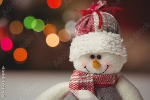 Obraz Close-up of snowman on wooden table