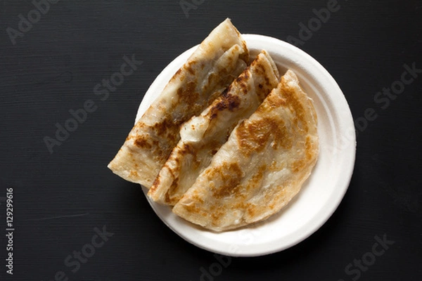 Obraz Roti Top view on black background