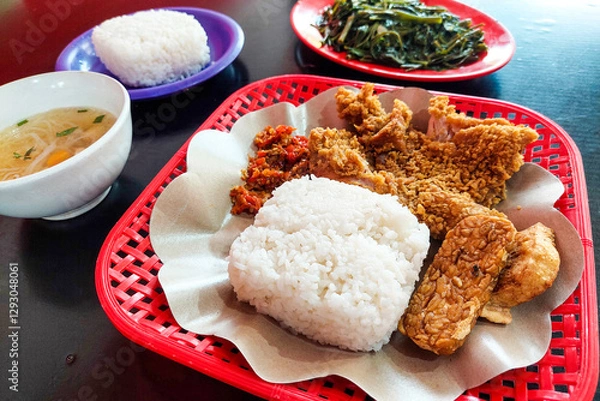 Fototapeta Crispy chicken, vegetables, soup and kale are ready to eat