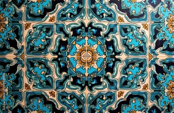 Fototapeta Detail of Ince Minare Medresesi tile art from Konya, Turkey. Ornate turquoise, black, gold mosaic pattern features aged traditional oriental architecture. Interior design element, cultural heritage