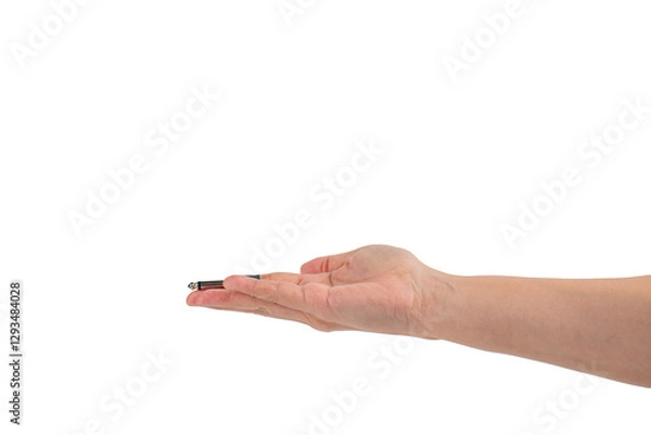 Fototapeta Hand and black audio cable aux isolated on transparent background