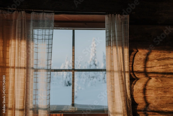 Fototapeta Lapland in the snow, landscapes of pristine snow topped trees and magical golden light in the artic circle. High res photography 