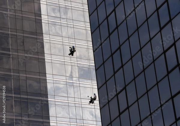 Fototapeta Window cleaners work on skyscraper