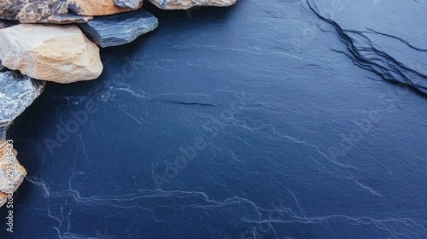 Obraz Calm water surface reflecting intricate patterns, bordered by ru