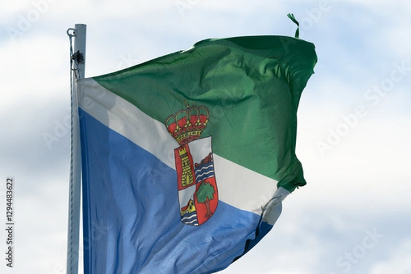 Fototapeta Close-up of the flag of Santoña waving in the wind