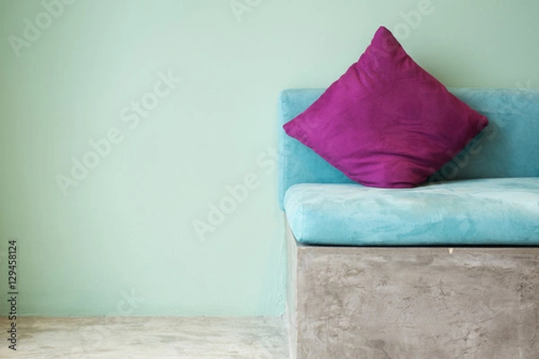 Obraz purple pillow on aqua sofa,interior concept