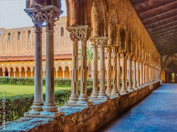Obraz Columns in Sicilian cathedral courtyard bathed in golden light