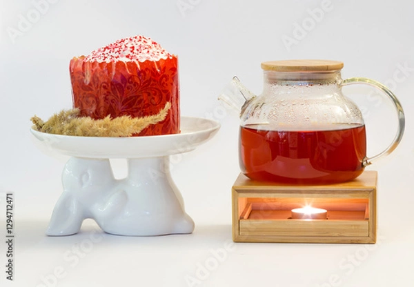 Fototapeta Easter cake on a plate in the shape of an Easter bunny with a teapot on a white background