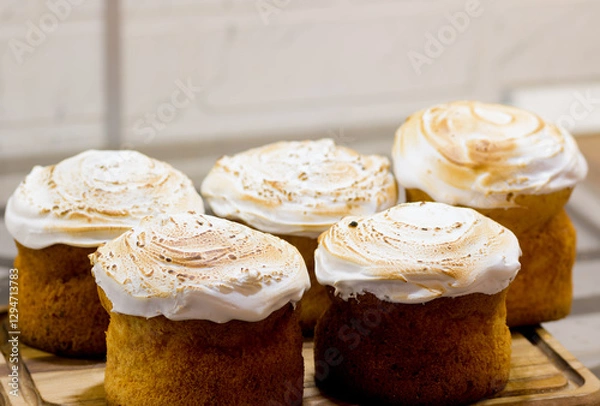 Fototapeta Easter cakes with powdered sugar on a grey background