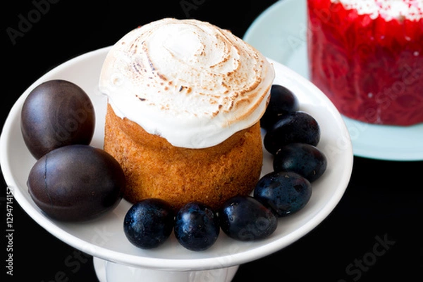 Obraz Easter cake on a white plate with Easter eggs on a black background