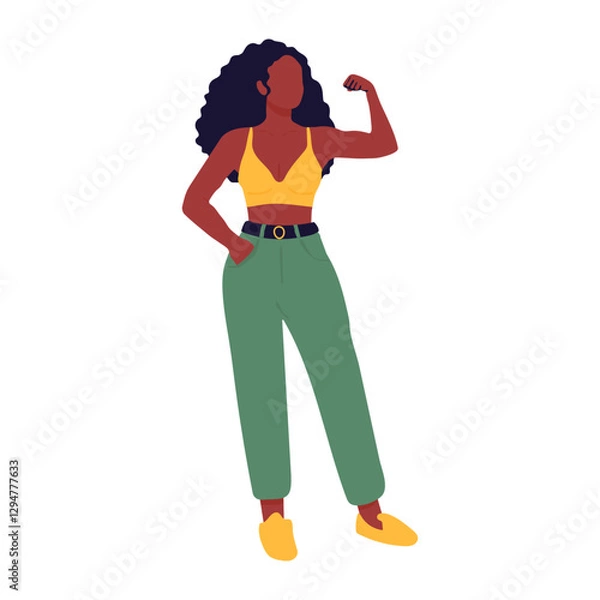 Fototapeta A woman in a yellow top and green pants is posing for a picture. She is standing with her arms crossed and looking straight ahead