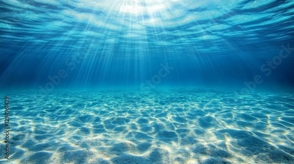 Fototapeta Underwater view of the deep blue sea with sunlight filtering through. serenity. calmness concept