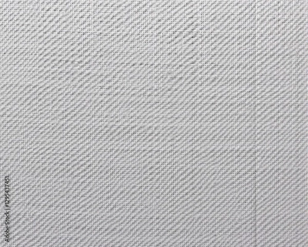 Fototapeta A close-up of a textured gray fabric, showcasing a subtle pattern that adds depth and interest to the surface.