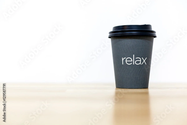 Obraz Coffee cup on wood table and white background.