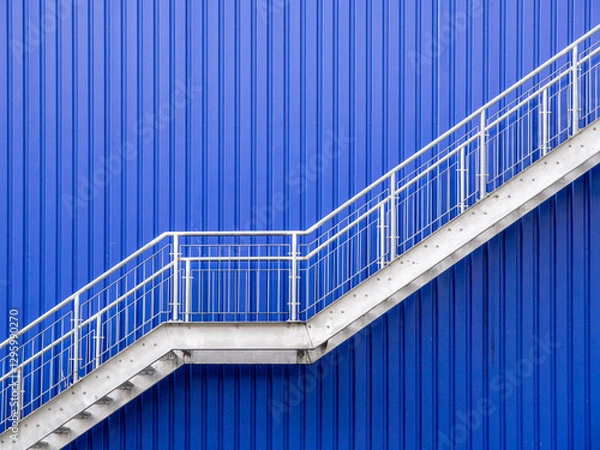Obraz A galvanized steel stairs against a blue metal wall