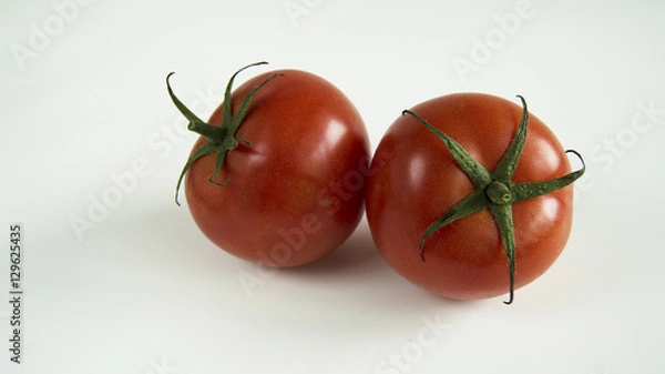 Obraz two red tomatoes on white background
