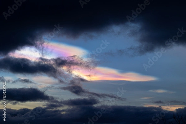 Obraz A rare polar stratospheric cloud display in the winter skies in Norway. Colorful ice crystals in the sky in sun rays. Arctic nature in Scandinavia during winter season.