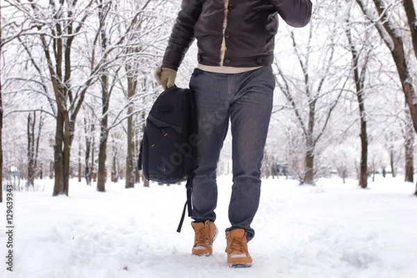 Obraz bearded man walking in a winter park