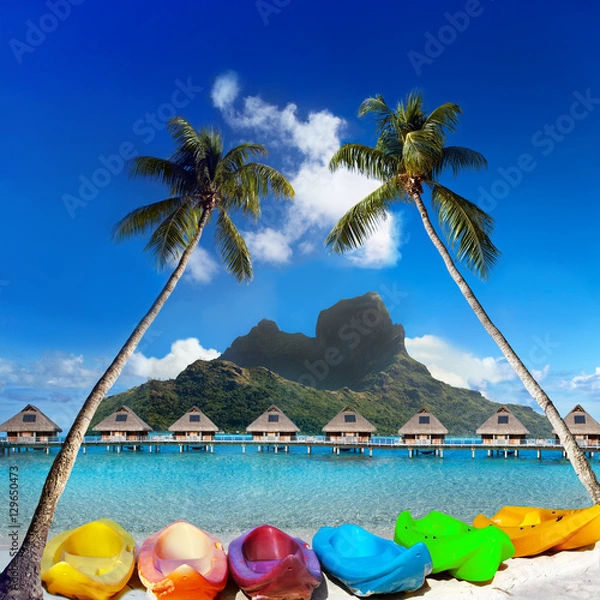 Obraz bright canoes between palm trees and the mountain Otemanu. Bora-Bora. Tahiti..