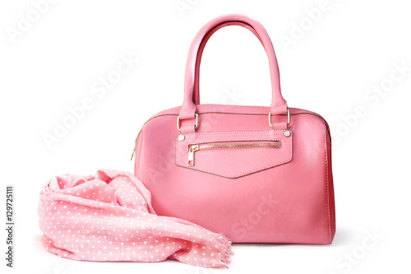 Fototapeta Stylish women's accessories. Beautiful set of women's handbag and scarf on a white background. Light pink, light coral