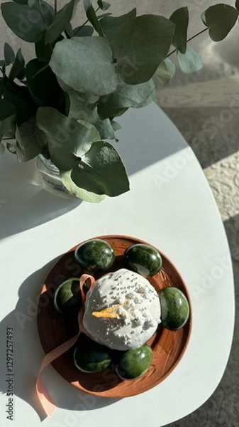 Obraz Photo of Easter table decorated in green tones.