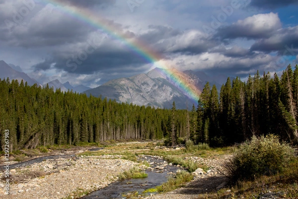 Fototapeta Scenic landscape showing a rainbow over the canadian rockies
