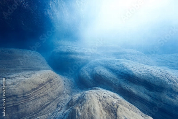 Obraz Underwater view of the ocean floor with sunlight filtering through