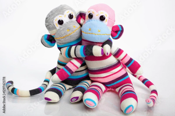 Obraz Monkey sock toys isolated on white background. Giving a hug. Ful