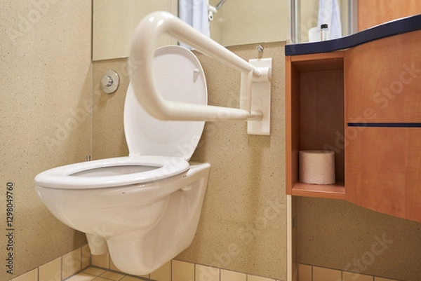 Fototapeta A public toilet for people with disabilities. Special plastic handrails in the bathroom. With space to copy. High quality photo