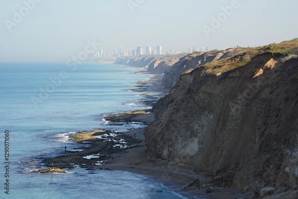 Fototapeta Mediterranean sea in spring. Deserted shorekurkar sandstone cliff nature reserve, high above the Mediterranean sea coastline between Herzliya and Netanya towns, Israel.