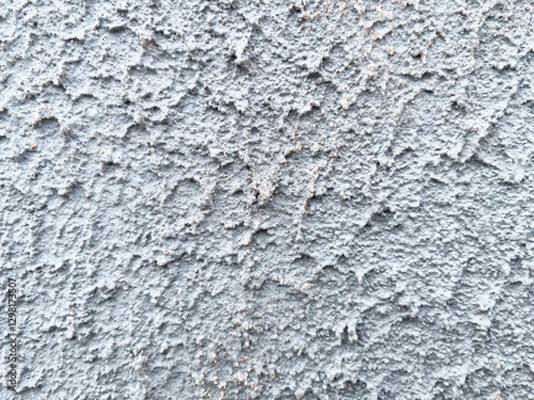 Fototapeta Rough texture of a concrete wall with cracks and irregularities. Gray tones, ideal for urban projects, backgrounds or industrial design. High quality, detail